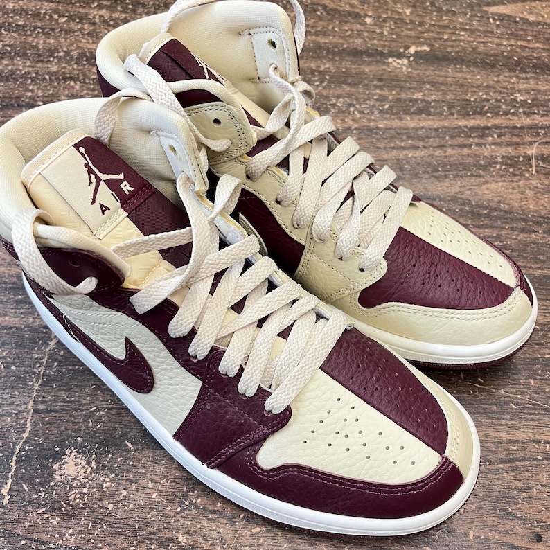 May include: A set of three ceramic mugs with a speckled, matte finish. The mugs are in shades of cream, light gray, and dark gray. Each mug has a simple, minimalist design, perfect for coffee or tea.