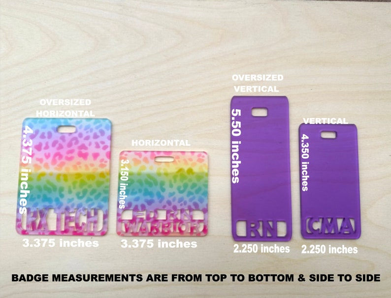 May include: Four different sizes of name badges with various designs. The badges are made of plastic and have a rainbow, leopard print, and solid purple design. The badges are 2.25 inches wide and 4.35 inches tall. The badges are labelled with the text "RN", "CMA", "Warrior", and "Rx Tech".