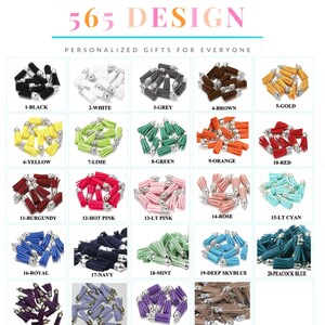 May include: A chart showing 24 different colors of small tassels with silver tops. The tassels are arranged in a grid of four rows and six columns. Each color has a number and a name, such as 1-Black, 2-White, 3-Grey, and so on.