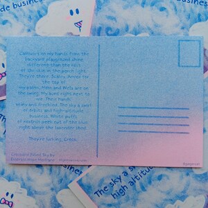 May include: A postcard with a blue and pink gradient. The left side has handwritten text, the right side has lines for an address. The text includes "Crocodile Filled Sky" and the artist's name. The postcard is a unique piece of art.