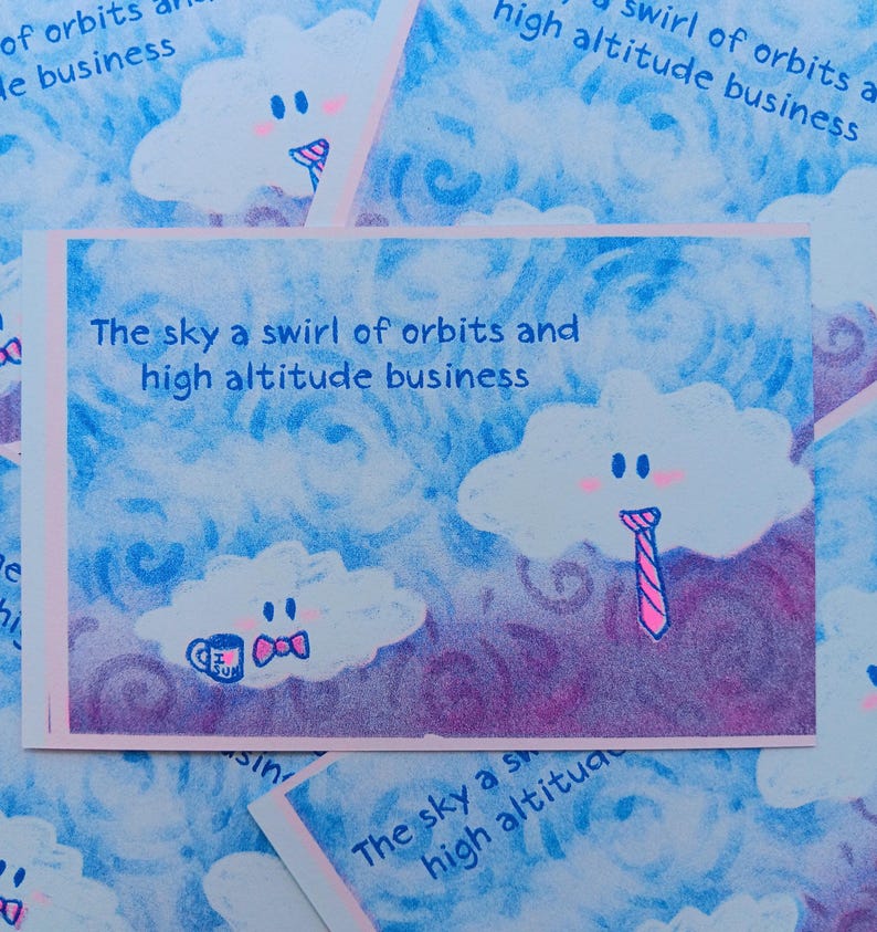 May include: A pile of cards with a blue and purple sky design. Each card features a cloud with a face and the text "The sky a swirl of orbits and high altitude business". One cloud wears a pink tie.