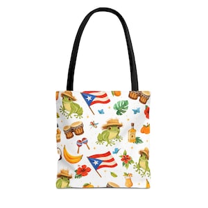 May include: White tote bag with a black handle featuring a repeating pattern of frogs in straw hats, Puerto Rican flags, drums, maracas, and other tropical elements. The bag is designed for carrying items.