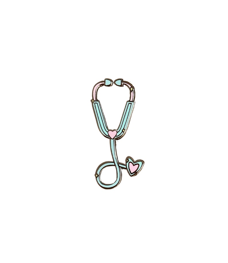May include: A light blue stethoscope with a pink heart on the chest piece and a pink heart on the end of the tubing.