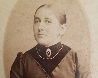 cdv woman tiny waist and wearing a lovely brooch