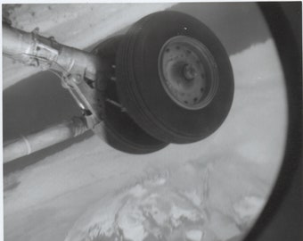 original snapshot in flight airplane wheel