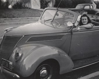 original photo of a woman at the wheel of a convertible