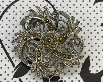 Vintage costume jewellery brooch, elegant silver coloured metal, sparkly brooch