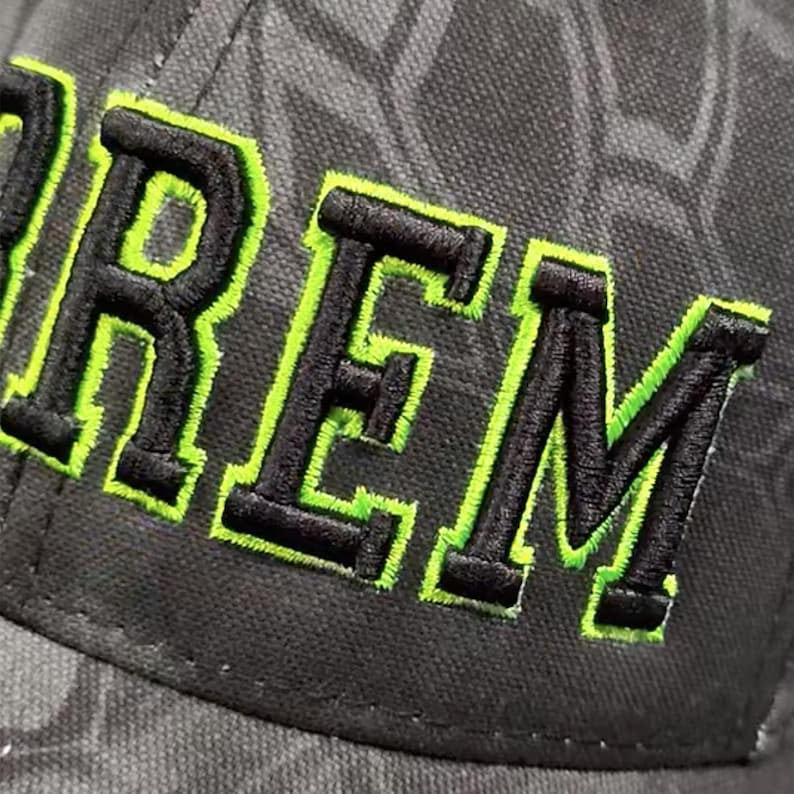 Ham radio embroidered callsign hat with 3d stitching and neon green outline. Up close stitching detail.