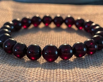 EvaDane Natural Garnet Gemstone Tibetan Bead Triskele Charm Stretch Bracelet EvaDane Natural Garnet Gemstone Tibetan Bead Triskele Charm Stretch Bracelet