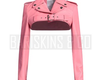 May include: A pink cropped leather jacket with a zipper closure and a buckle belt. The jacket has long sleeves and a collar.