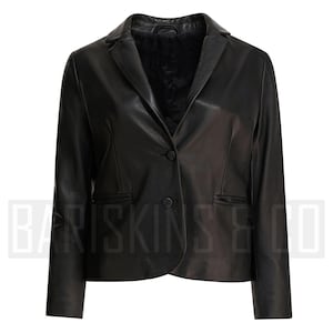 May include: A black leather blazer featuring a notched lapel, single-button fastening, and two front pockets. The jacket has a tailored fit and long sleeves. The brand name "BARISKINS & CO" is visible at the bottom of the image.