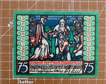 May include: A green and white historical print with the text "DIE SACHSENTAUFE" and "KARLSGR LIPPE, ANG 776." The image depicts a scene with figures in robes and a kneeling person. The number "75" is in the corners.