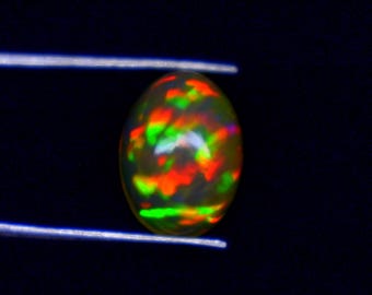 Ethiopian Fire Opal Cabochon: AAA Grade Gemstone (10.6x7.7x4.4)