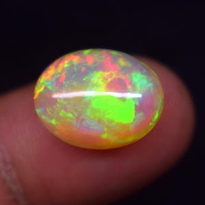 AAA Multi Fire 6.2 Carat  Natural Ethiopian Opal , Gemstone Oval Shape Opal , Cabochon Gemstone, 15.3X11.9X6.8 MM.