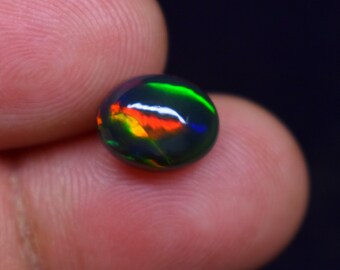 Galaxy Fire 1.90 Carat Natural Ethiopian Black Smoked Oval Shape Opal Cabochon Gemstone, 10x8x5 MM.