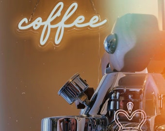 May include: A chrome espresso machine with a wooden handle and a pressure gauge, featuring a neon sign above it that reads coffee in white cursive script. A pink neon crown icon and the text Candy Sign are visible in the lower right corner.