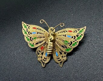 Broche vintage de mariposa multicolor bañado en oro de los años 60