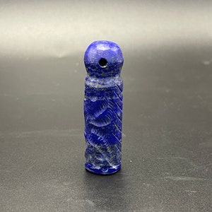 A vintage lapis lazuli pendant with a unique design