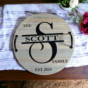 Whether you're looking to enhance your living room ottoman table or searching for the perfect  personalized gift, Our 18" round wood tray featuring a monogram name design that will add a personal touch to any space.