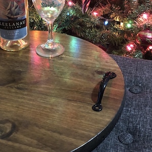 Whether you're looking to enhance your living room ottoman table or searching for the perfect  personalized gift, Our 18" round wood tray featuring a monogram name design that will add a personal touch to any space.