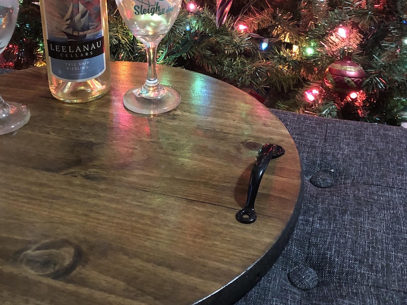 Whether you're looking to enhance your living room ottoman table or searching for the perfect  personalized gift, Our 18" round wood tray featuring a monogram name design that will add a personal touch to any space.