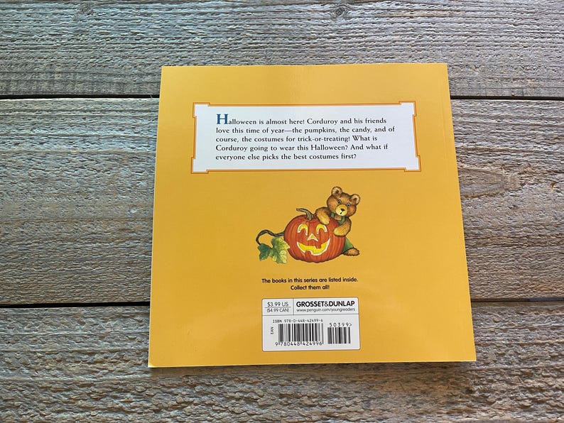 May include: The back cover of a children's book featuring Corduroy the bear dressed as a pumpkin. The text reads "Halloween is almost here! Corduroy and his friends love this time of year - the pumpkins, the candy, and of course, the costumes for trick-or-treating! What is Corduroy going to wear this Halloween? And what if everyone else picks the best costumes first?"