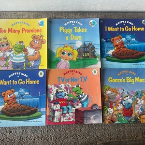 May include: A set of six Muppet Kids books featuring colourful illustrations of popular Muppet characters. The titles include "Too Many Promises", "Piggy Takes a Dare", "I Want to Go Home", "TV or Not TV", and "Gonzo's Big Mess".