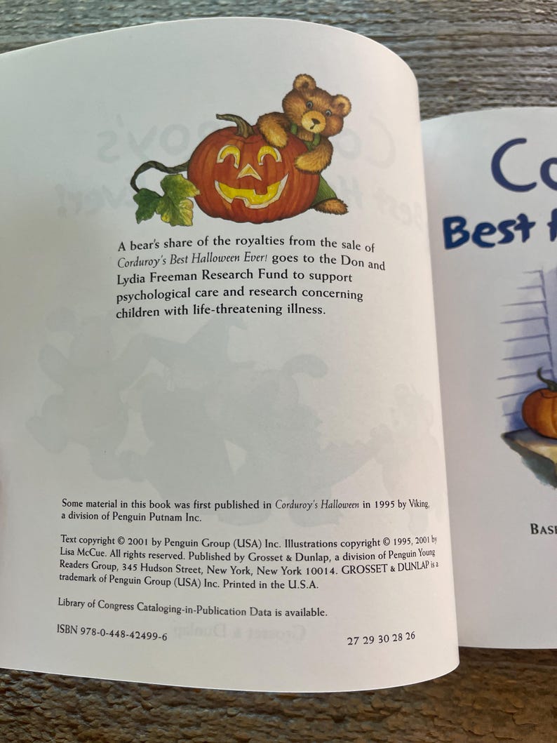 May include: A book cover with a picture of a teddy bear holding a jack-o-lantern. The book title is "Corduroy's Best Halloween Ever!" and the text says that a portion of the royalties from the sale of the book goes to the Don and Lydia Freeman Research Fund to support psychological care and research concerning children with life-threatening illness.