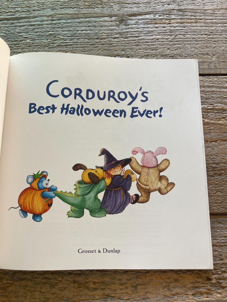 May include: A children's book cover featuring a group of plush toys dressed in Halloween costumes. The book title is "Corduroy's Best Halloween Ever!" and the publisher is "Grosset & Dunlap".