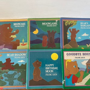 May include: A set of ten children's books by Frank Asch. The books feature colorful illustrations of bears and other animals. The titles of the books are "Mooncake", "Moongame", "Bear's Bargain", "Bear Shadow", "Happy Birthday, Moon", and "Goodbye House".