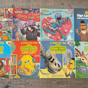 May include: A collection of ten Sesame Street children's books. The books feature various characters from the show, including Big Bird, Elmo, Cookie Monster, and Grover. The books are all in good condition and have colorful covers.