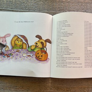 May include: Three plush toys, a pink bunny, a brown bear, and a brown dog, are sitting at a table with candy and a glass of milk. The text "It was the best Halloween ever!" is visible on the page. The page is from a children's book.