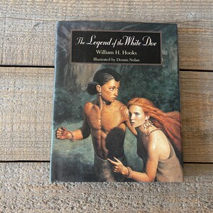 May include: The Legend of the White Doe book cover features an illustration of a young man and woman in a forest setting. The book title is printed in white on a black background. The author is William H. Hooks and the illustrator is Dennis Nolan.