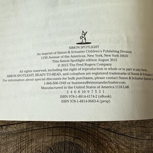 May include: A book page with text from Simon Spotlight, an imprint of Simon & Schuster Children's Publishing Division. The text includes copyright information, address, and ISBN numbers. The page is white with black text and a small logo.