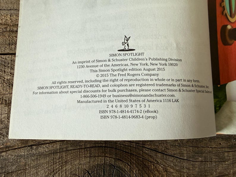 May include: A book page with text from Simon Spotlight, an imprint of Simon & Schuster Children's Publishing Division. The text includes copyright information, address, and ISBN numbers. The page is white with black text and a small logo.