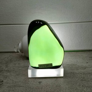 Polished natural andara crystal emerald green 994gr with base for decoration