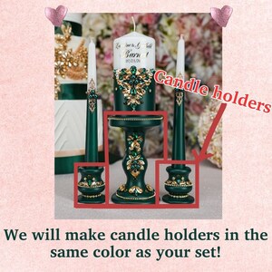 May include: Two green candle holders with gold accents and rhinestones. The candle holders are decorated with a floral design. The candle holders are on a white surface.