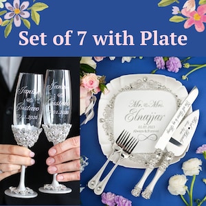 May include: A set of seven wedding-themed items, including two champagne flutes, a cake knife, a cake server, and a serving plate. The items are decorated with rhinestones and engraved with the names "Jane & Gustavo" and "Mr. & Mrs. Elnajjar" along with their wedding dates.