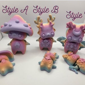 May include: Three colorful, hand-painted figurines in different styles: a mushroom, a deer, and a winged creature. Each figurine has a rainbow gradient and is labeled with the text "Style A", "Style B", and "Style C".