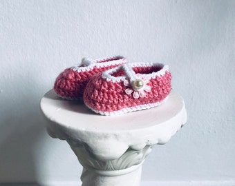 pink knitted newborn baby shoes