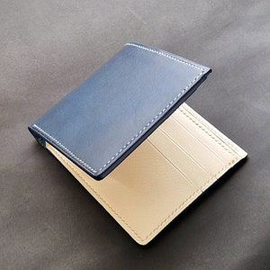 Cartera plegable delgada. Cartera "salón blanco". Plegable fabricado en piel de alta calidad. Ejecución manual.