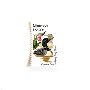 May include: A vintage Minnesota postage stamp featuring a common loon and a showy lady slipper flower. The stamp is green, brown, and pink with the text "Minnesota USA 20c".