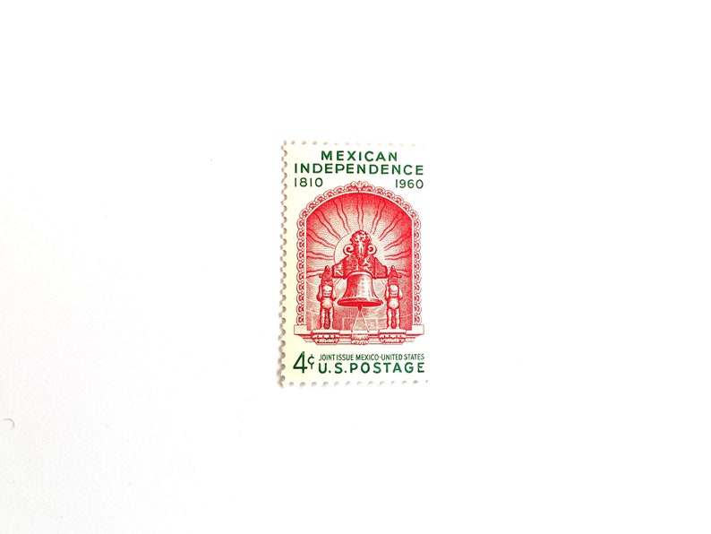 May include: A red and green 4-cent US postage stamp commemorating the 175th anniversary of Mexican Independence. The stamp features a bell with a sunburst behind it.