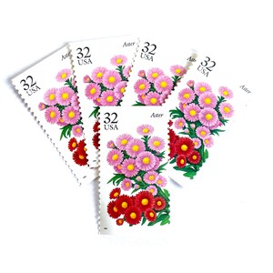 May include: Five vintage US postage stamps featuring a pink and red aster flower with the text "Aster" and "32 USA" on each stamp.