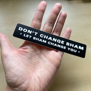 May include: Black and white sticker with the text "Don't change Bham, let Bham change you."