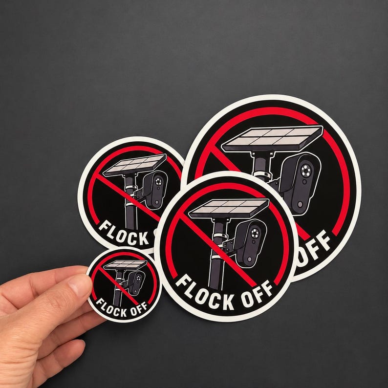 May include: Three circular stickers featuring a black and white illustration of a solar-powered security camera mounted on a pole. A red circle with a diagonal line overlays the camera. The text FLOCK OFF is printed in white at the bottom.