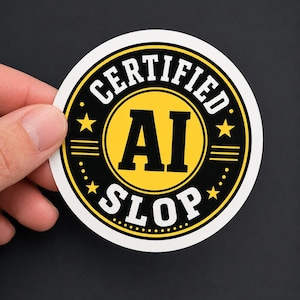 May include: A circular sticker featuring a yellow centre and a black border. The text CERTIFIED AI SLOP is printed in bold white and black lettering. The design includes four yellow stars, horizontal lines, and a dotted pattern around the edge.