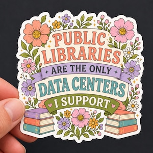 Puede incluir: Una pegatina troquelada con el texto "PUBLIC LIBRARIES ARE THE ONLY DATA CENTERS I SUPPORT" en una fuente decorativa. El diseño está rodeado de coloridas ilustraciones de flores rosas, moradas y amarillas, hojas verdes y dos pilas de libros.