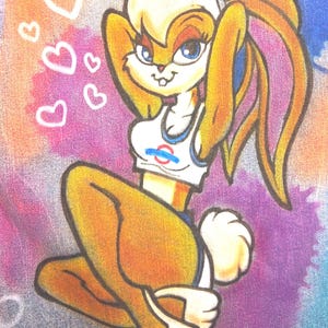 May include: Cartoon illustration of a female rabbit character with tan fur, wearing a white crop top with a logo and blue shorts. The background is a blend of pink, purple, and blue with white heart shapes.