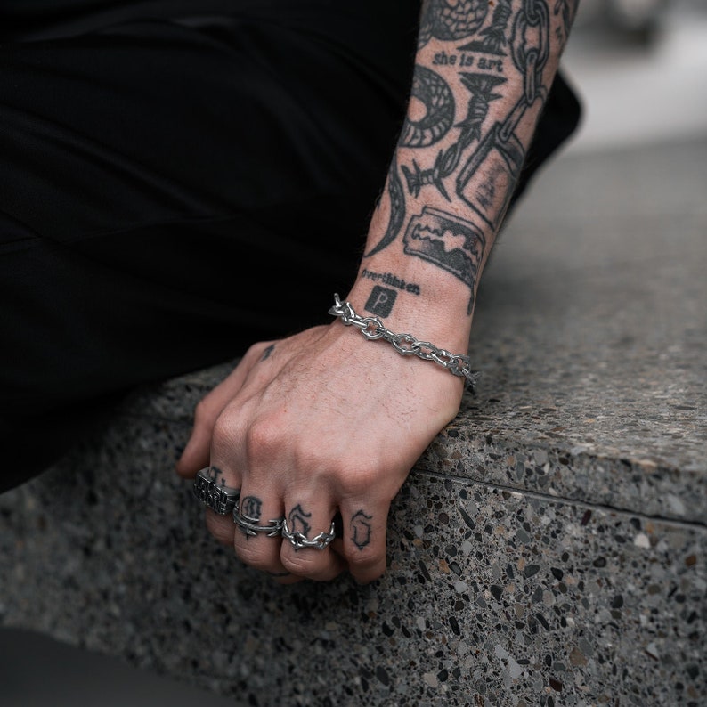 silver gothic bracelet on wrist